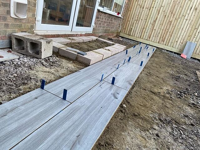 Installing these Italian Porcelain Planks from @paving_stones_direct_uk_ltd today another 38m2 to go. #porcelain #porcelainpaving #porcelainplank #porcelainplanktile #patio #porcelainpatio #paving #landscaping #landscapinggarden #landscapedesign #lan