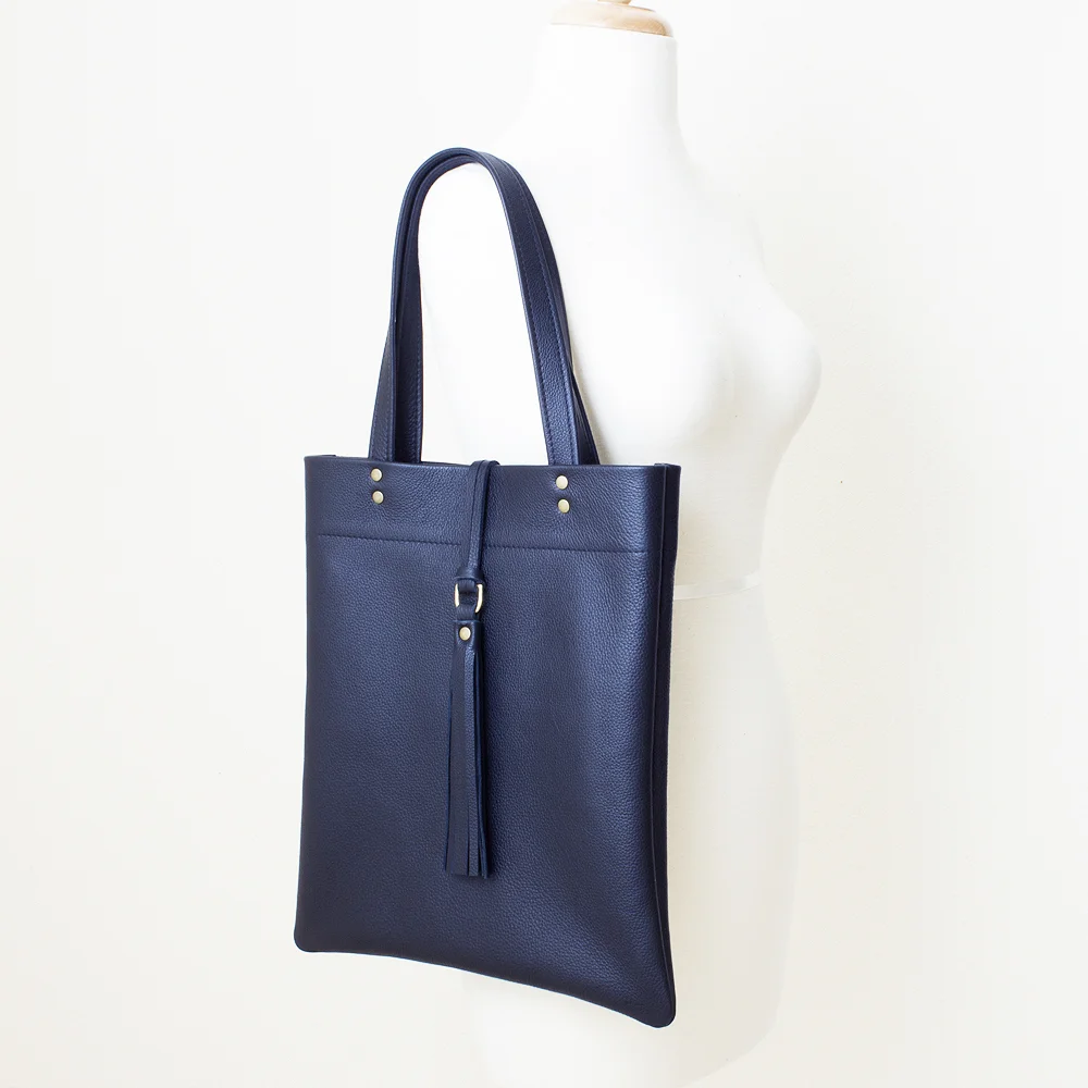 New Navy Leather Tote with Center Tassle Side View.jpg