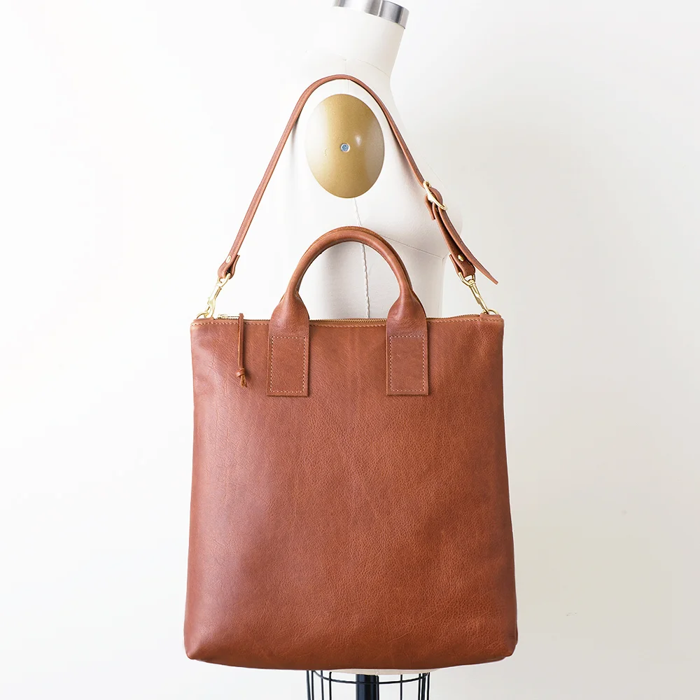 NEW Brown Leather Convertible Backpack On Shoulder Side.jpg