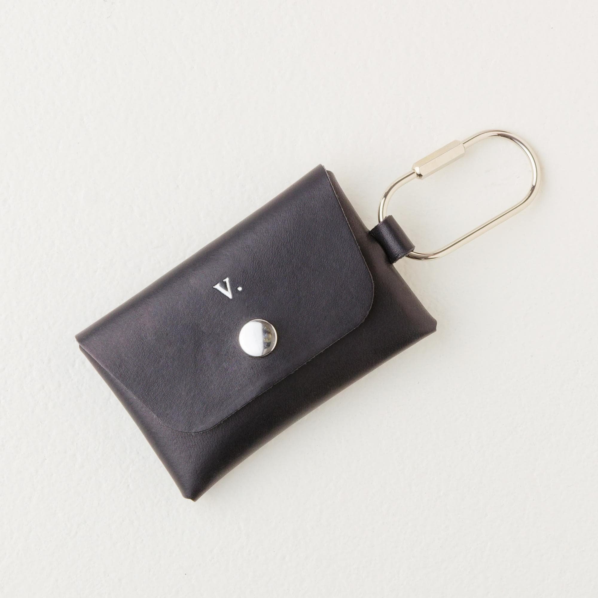 Personalized black leather carabiner keychain wallet / purse charm with silver finish hardware and silver foil monogram.