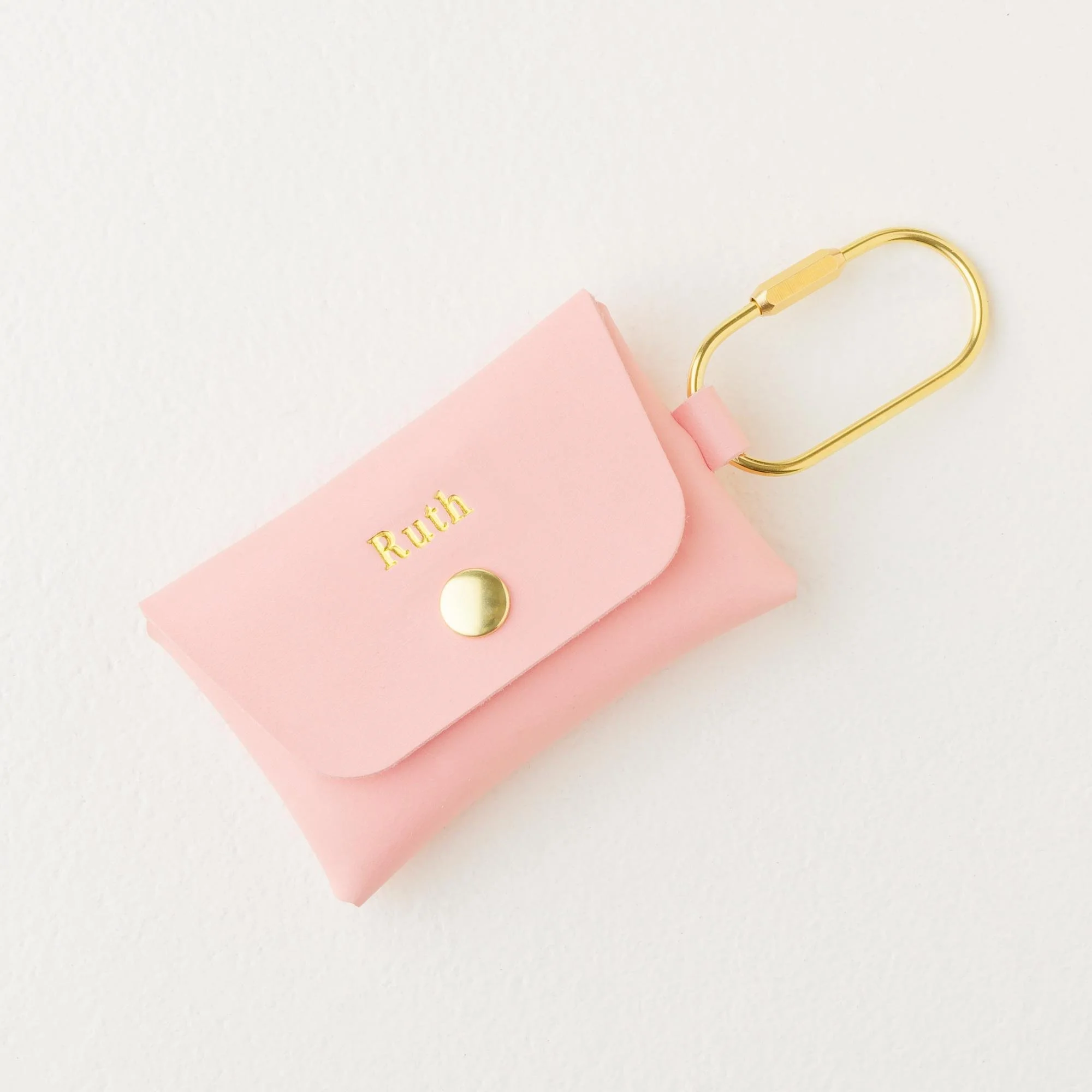 Personalized pink leather carabiner keychain wallet / purse charm with gold finish hardware and gold foil monogram.