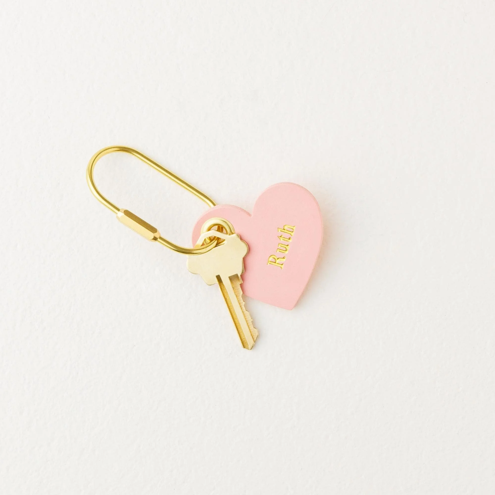 Personalized heart shaped pink leather carabiner purse charm / keychain with key and gold finish hardware.