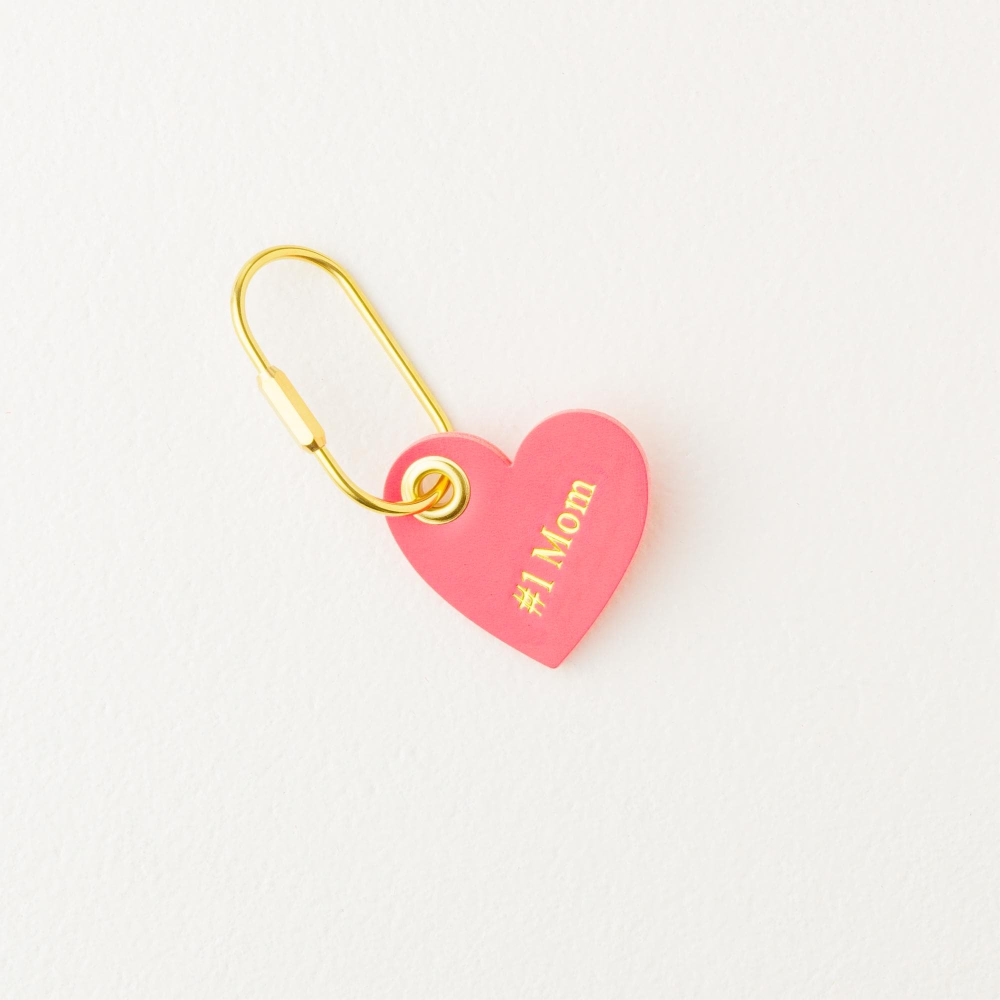 Personalized coral color heart shaped leather purse charm / keychain with gold finish hardware.