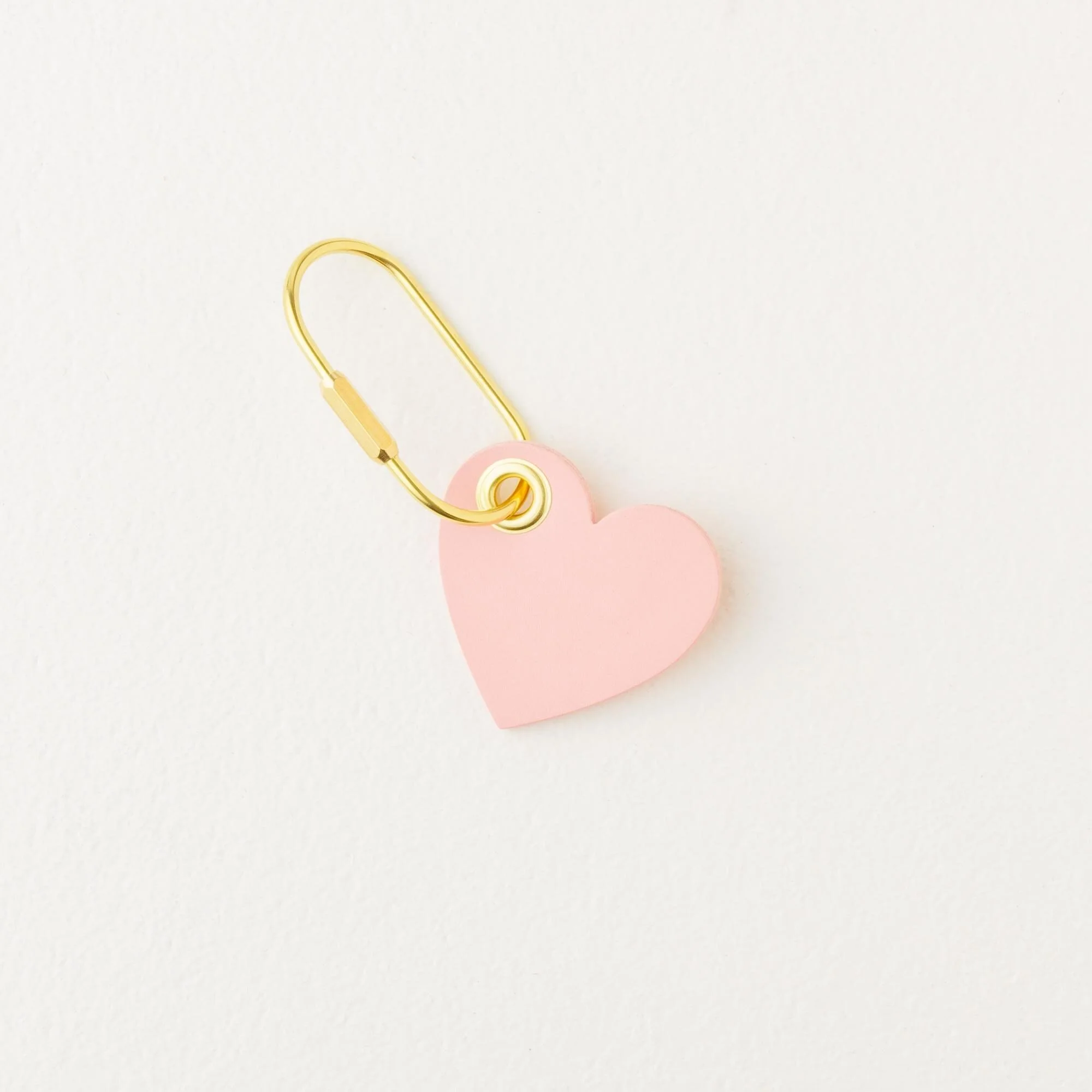 Pink heart shaped leather purse charm / keychain with gold finish hardware.