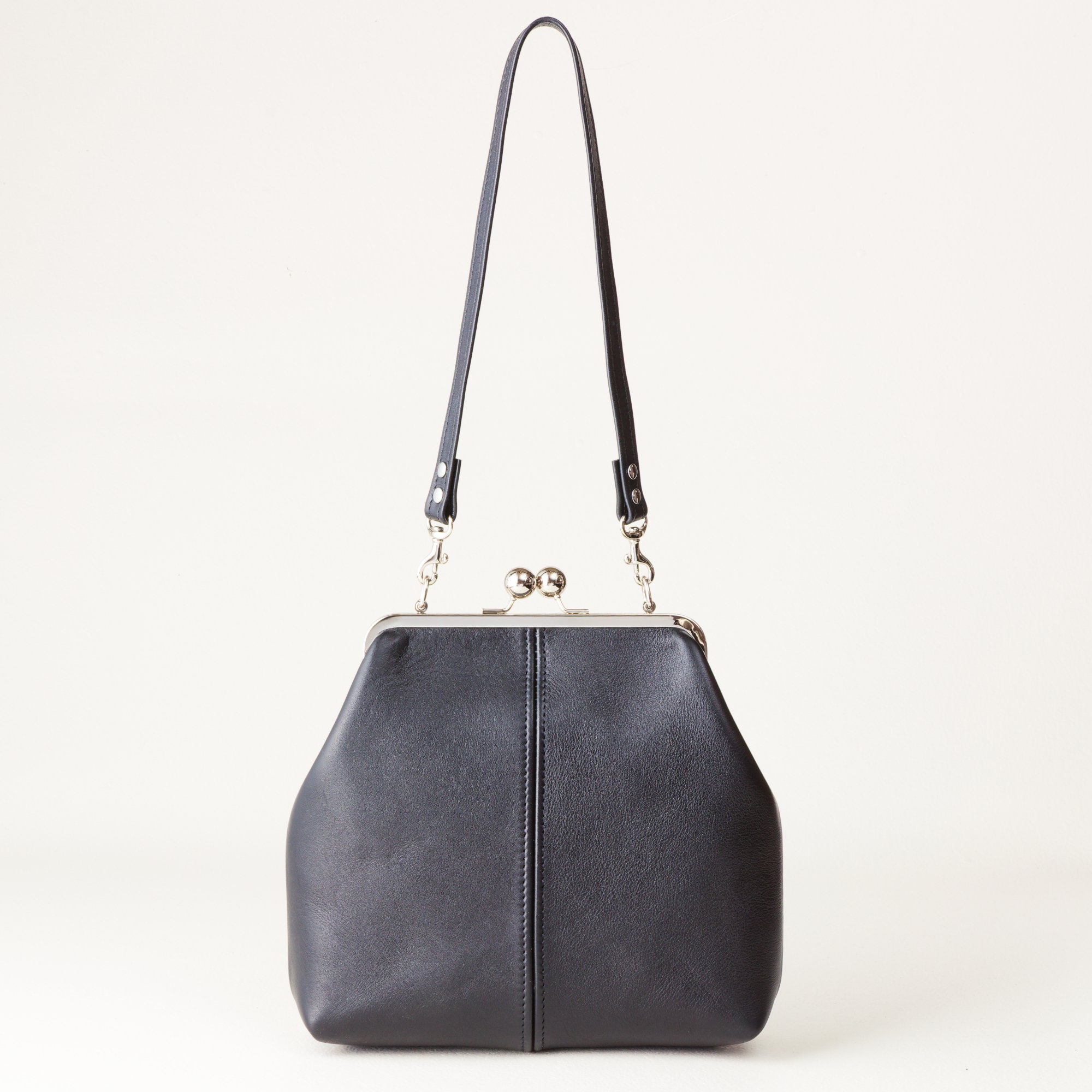 Standard Strap 8 inch Kiss Lock Handbag on Tabletop