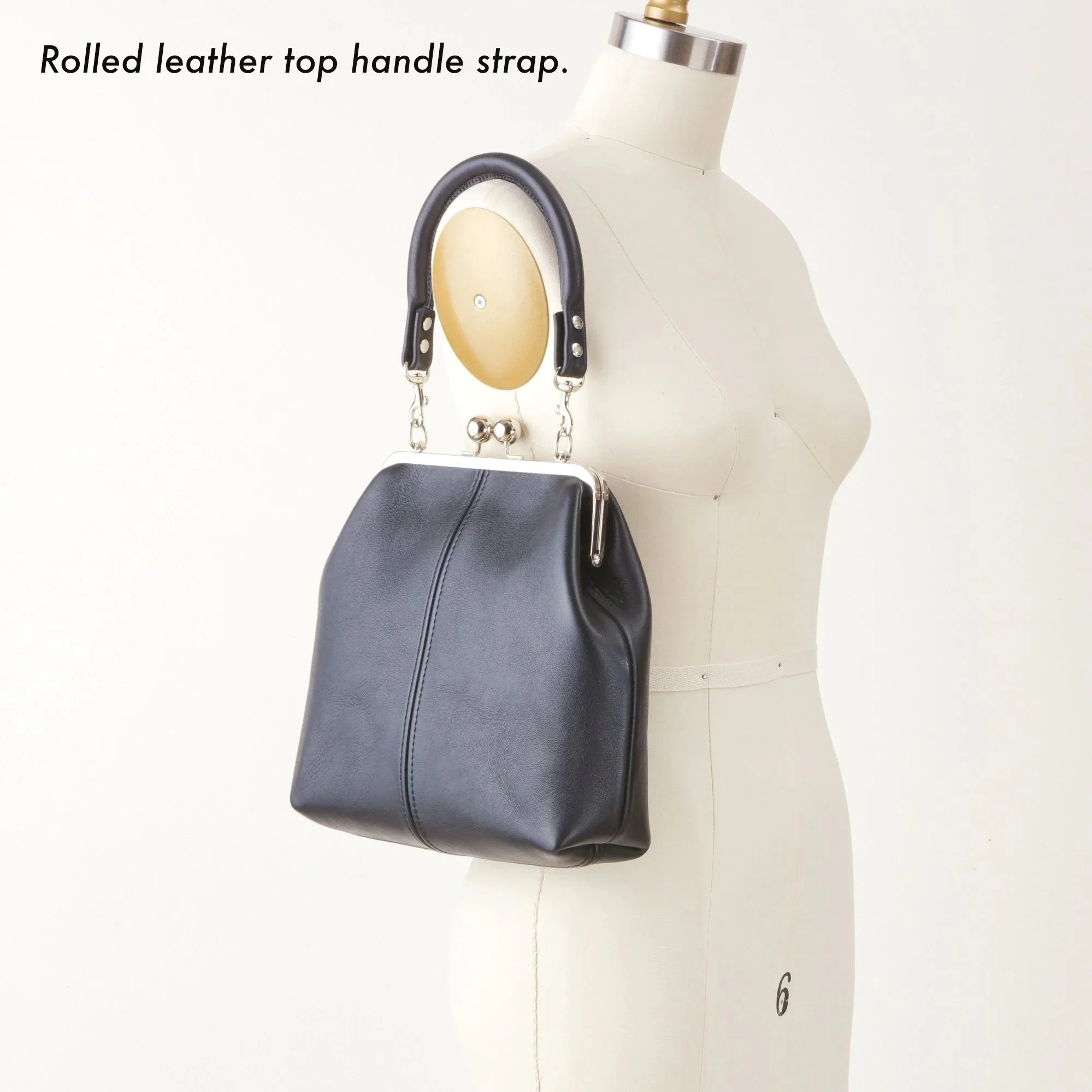 8+inch+Frame+Kiss+Lock+Bag+with+Rolled+Leather+Strap+Strap+with+Description.jpg