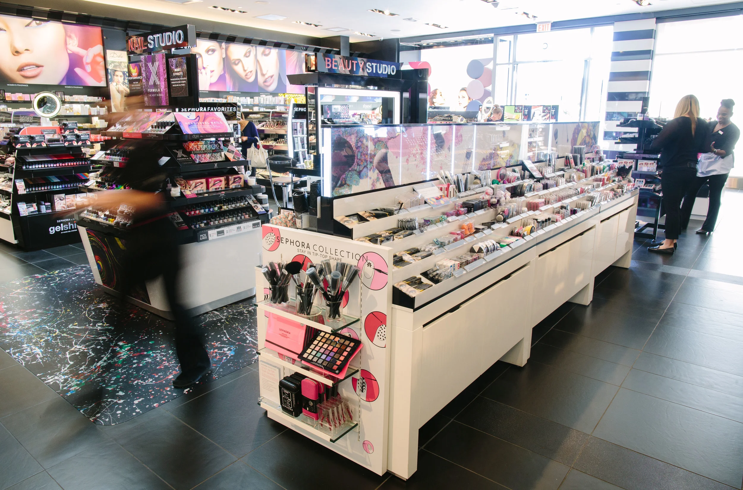 Sephora interior with cosmetics and accessories on display stands and shelves