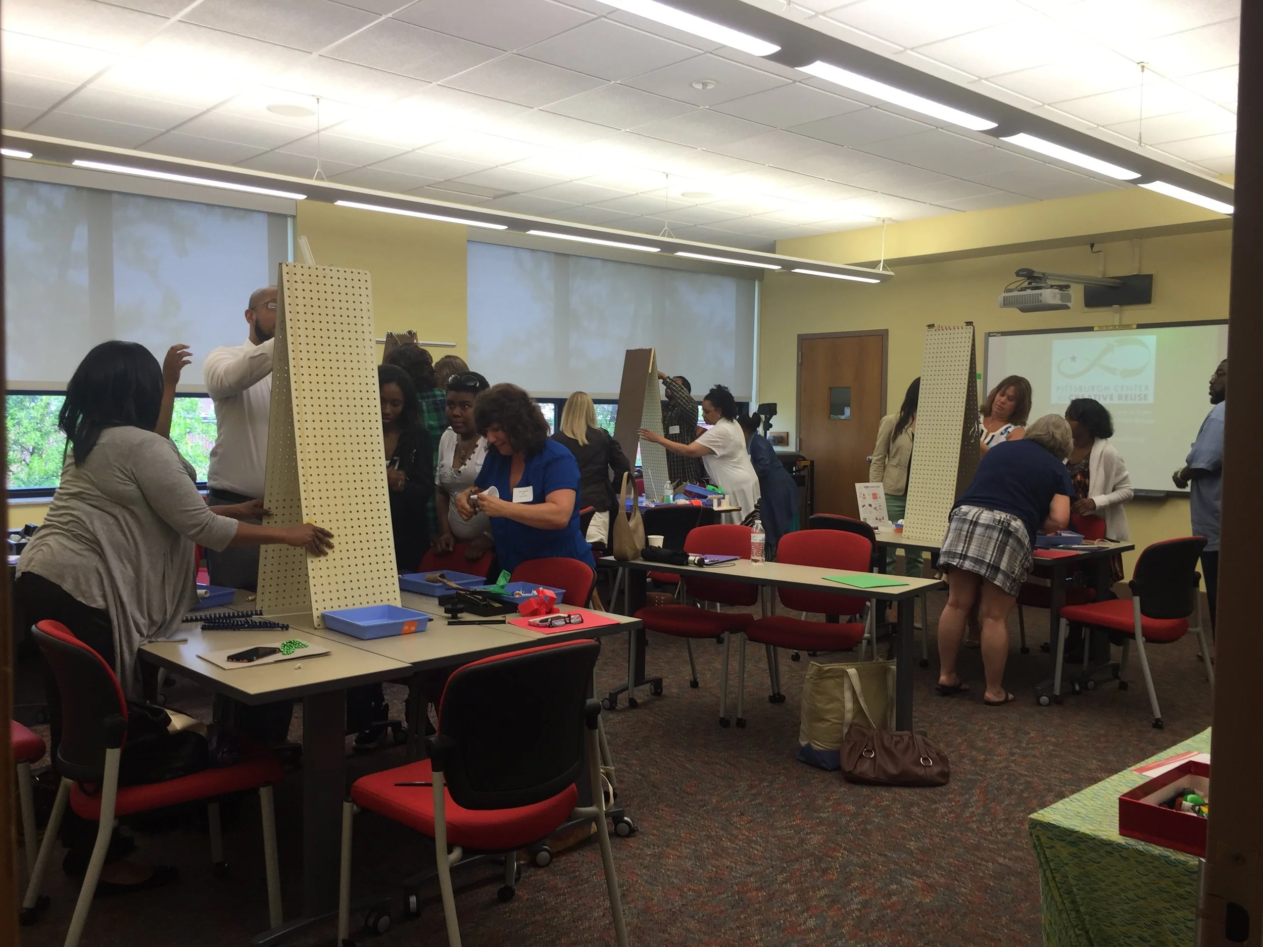 Educators building marble mazes