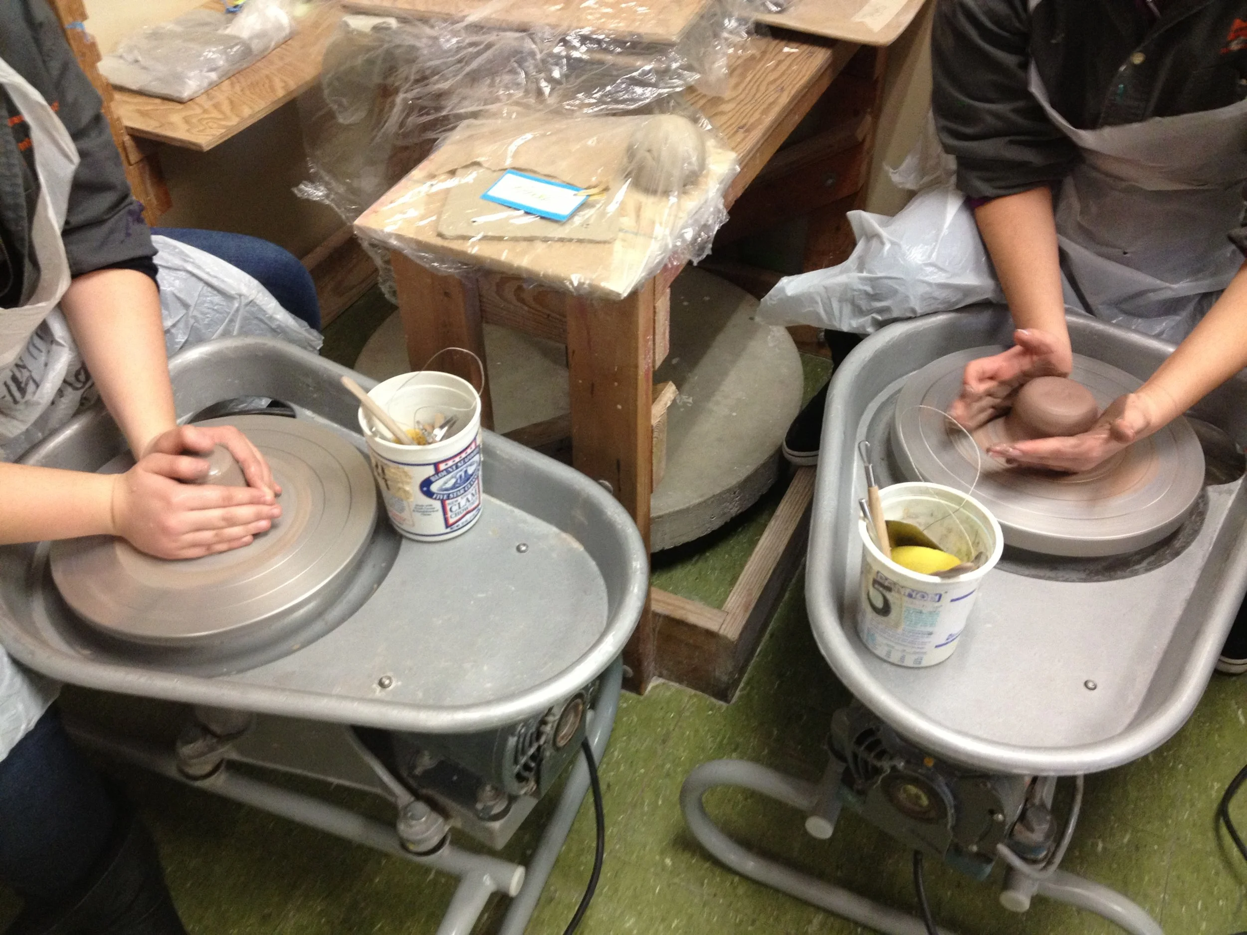 Student working on pottery wheels 