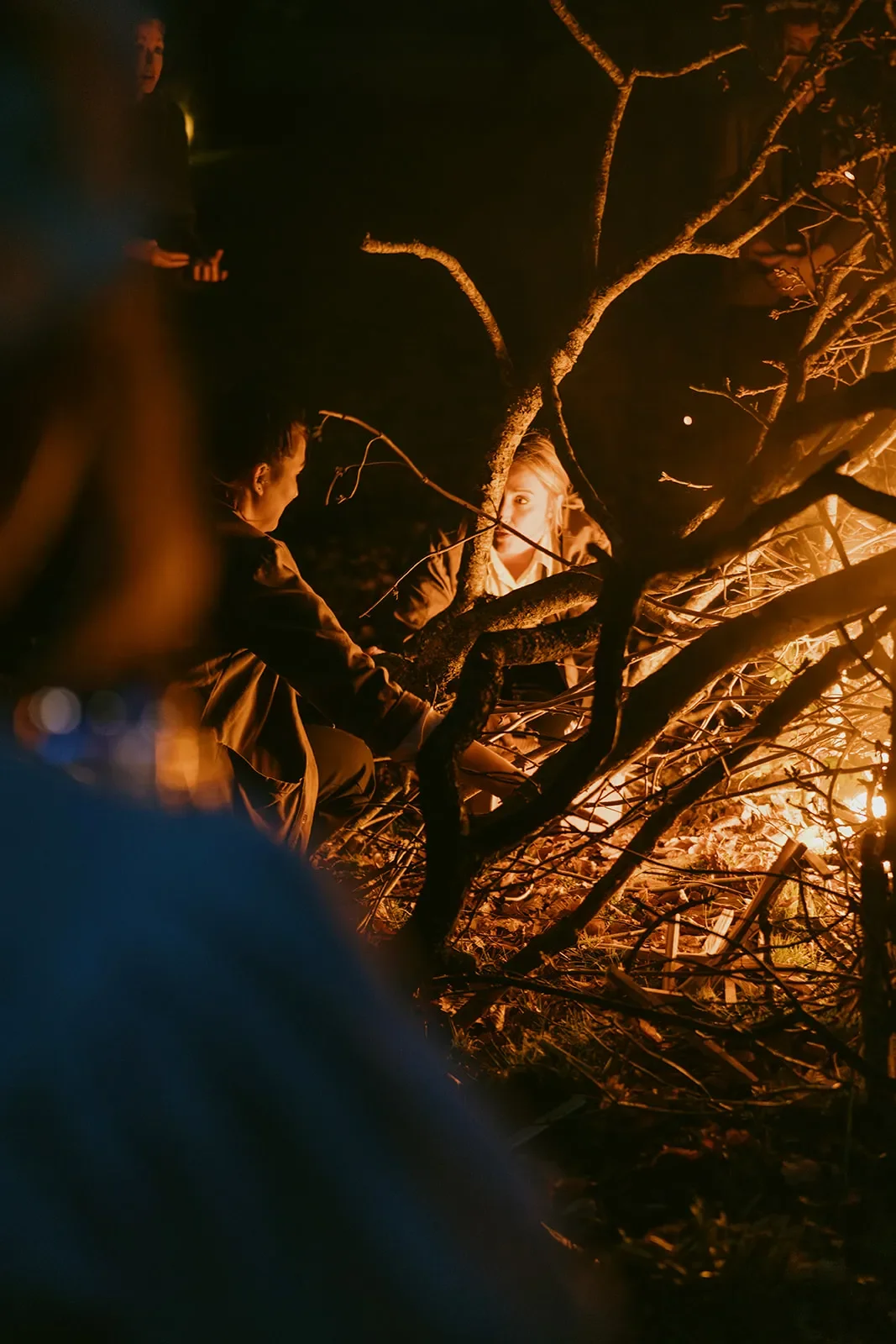 Guests cast papers into the bonfire of woes to be left behind in Winter, and wishes to be invited in with Spring..jpg.webp