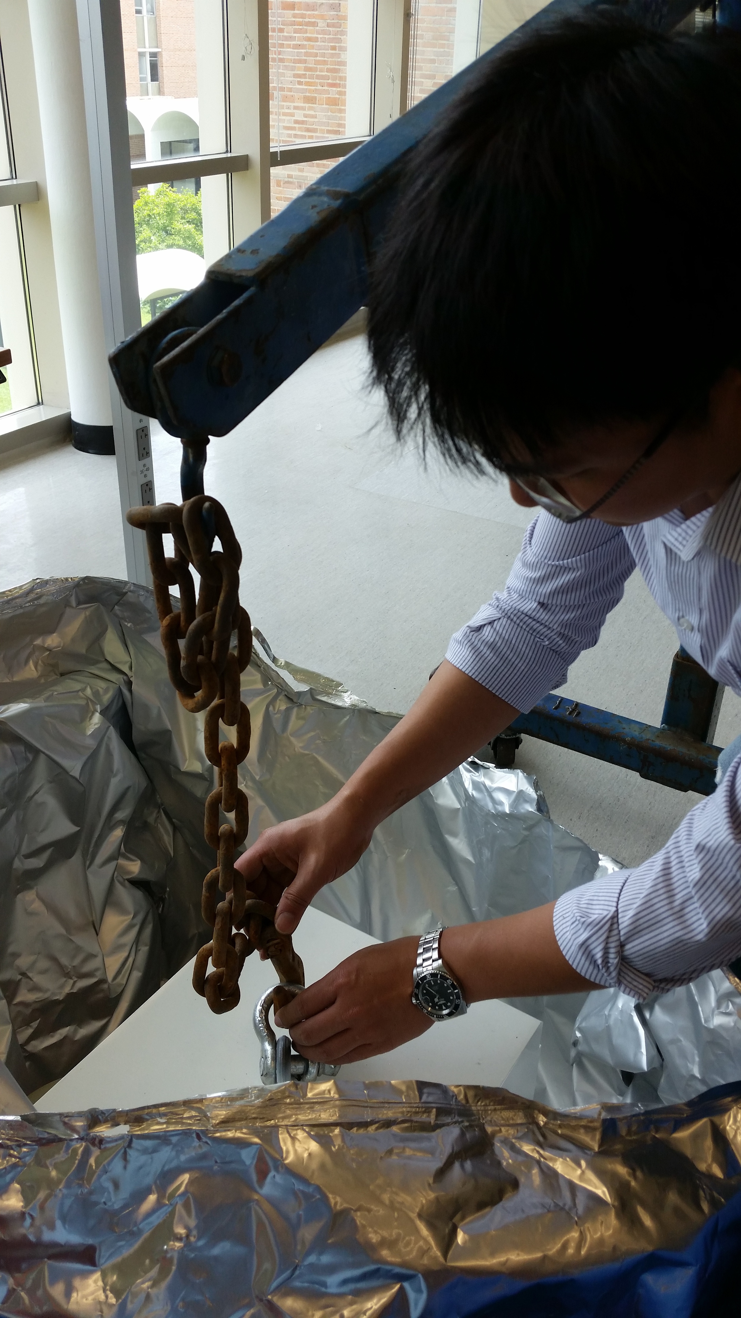 Attaching the hoist to the magnet's eye-bolt. Photo by Ian Mellor-Crummey.