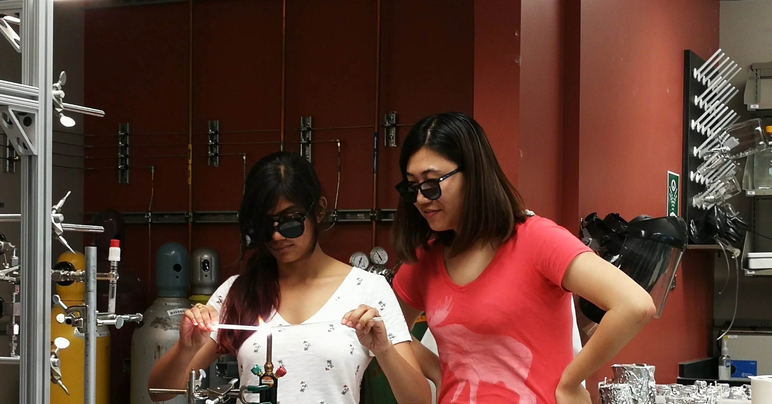 Huanting teaching Asmita how to make quartz glass breakseals (Photo by Tao Sun).