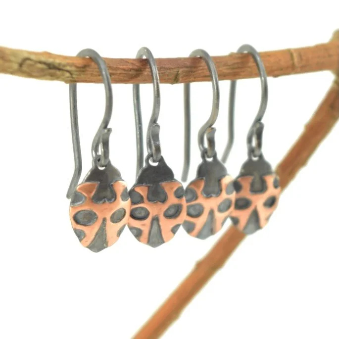 I forgot to post these little guys from the last update 🐞. They are oxidized sterling silver and bright copper- waxed to preserve the dual finish. Link in bio or lithicdesign.com

I&rsquo;m still stuck on crutches for another week and a half, but I&