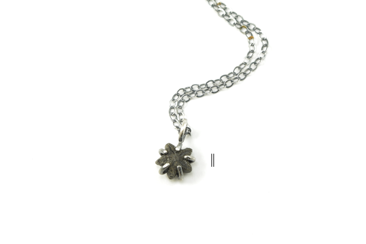 Black Crinoid Star Necklaces June 2026 II.png