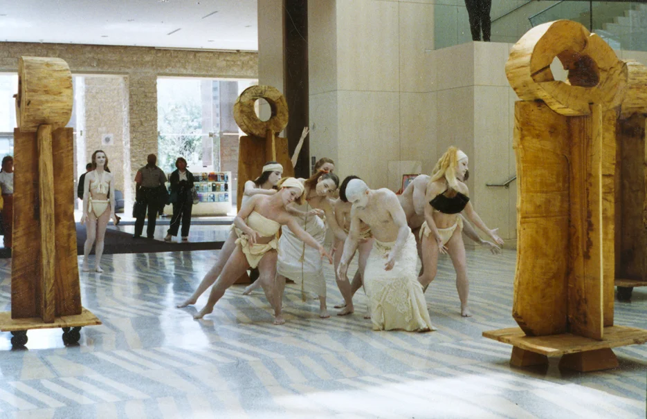 The Elders (Colossi series), shown with dancers, four wooden sculptures 