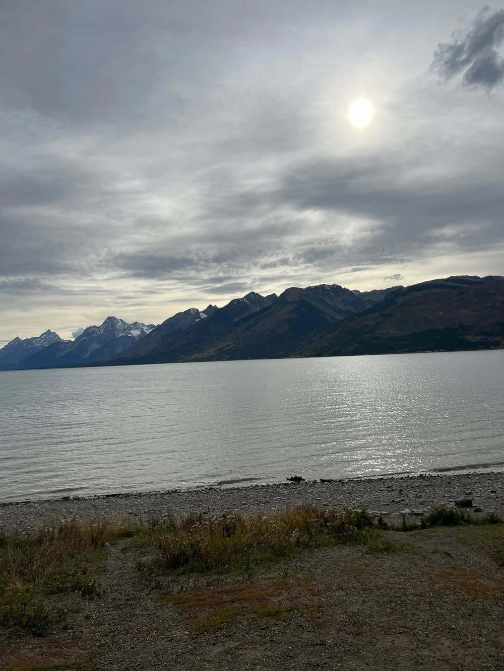 Yellowstone Lake with snow on mountains.jpeg