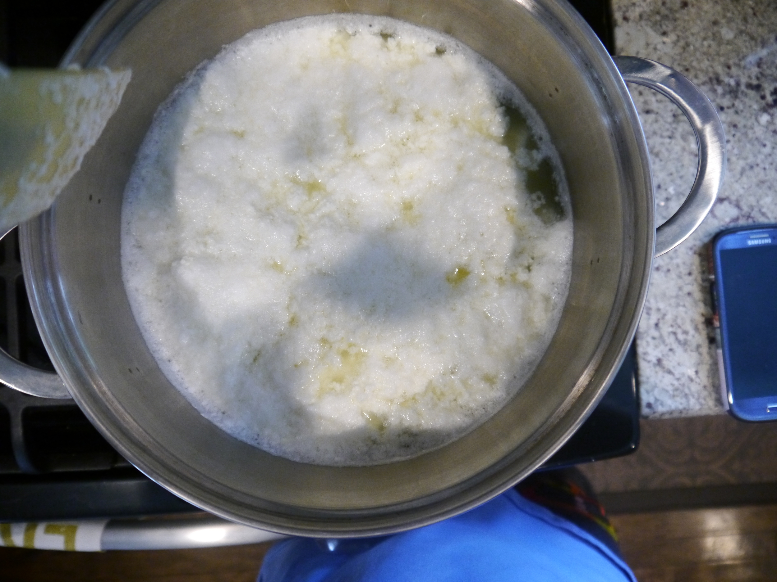 Once you pour in the vinegar, the mixture separates into curds and whey.
