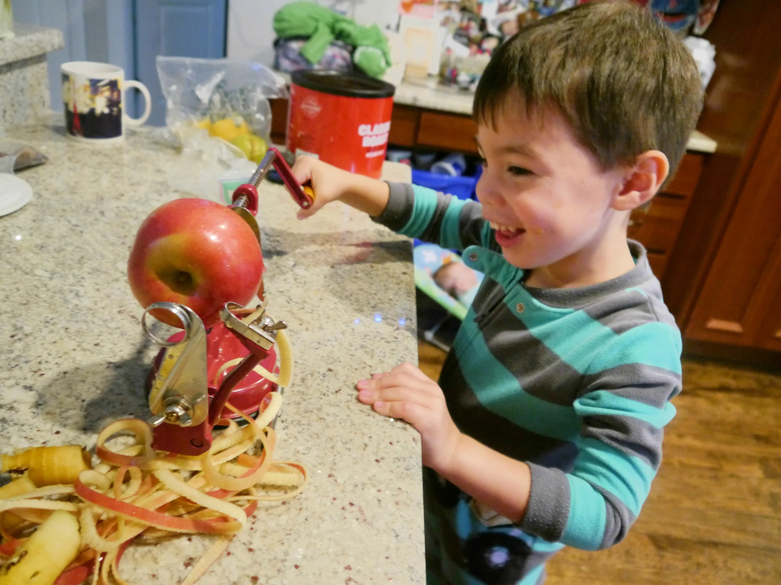 A few years ago I bought this apple corer, peeler, slicer, which is one of the few uni-taskers allowed in my kitchen. I’m so glad I have it. This was Emmett’s first time using it and he thoroughly enjoyed the experience. Isla was able to use it too (little miss “anything you can do I can do better” - she’s a competitive little bugger). They made quick work of 4 apples.