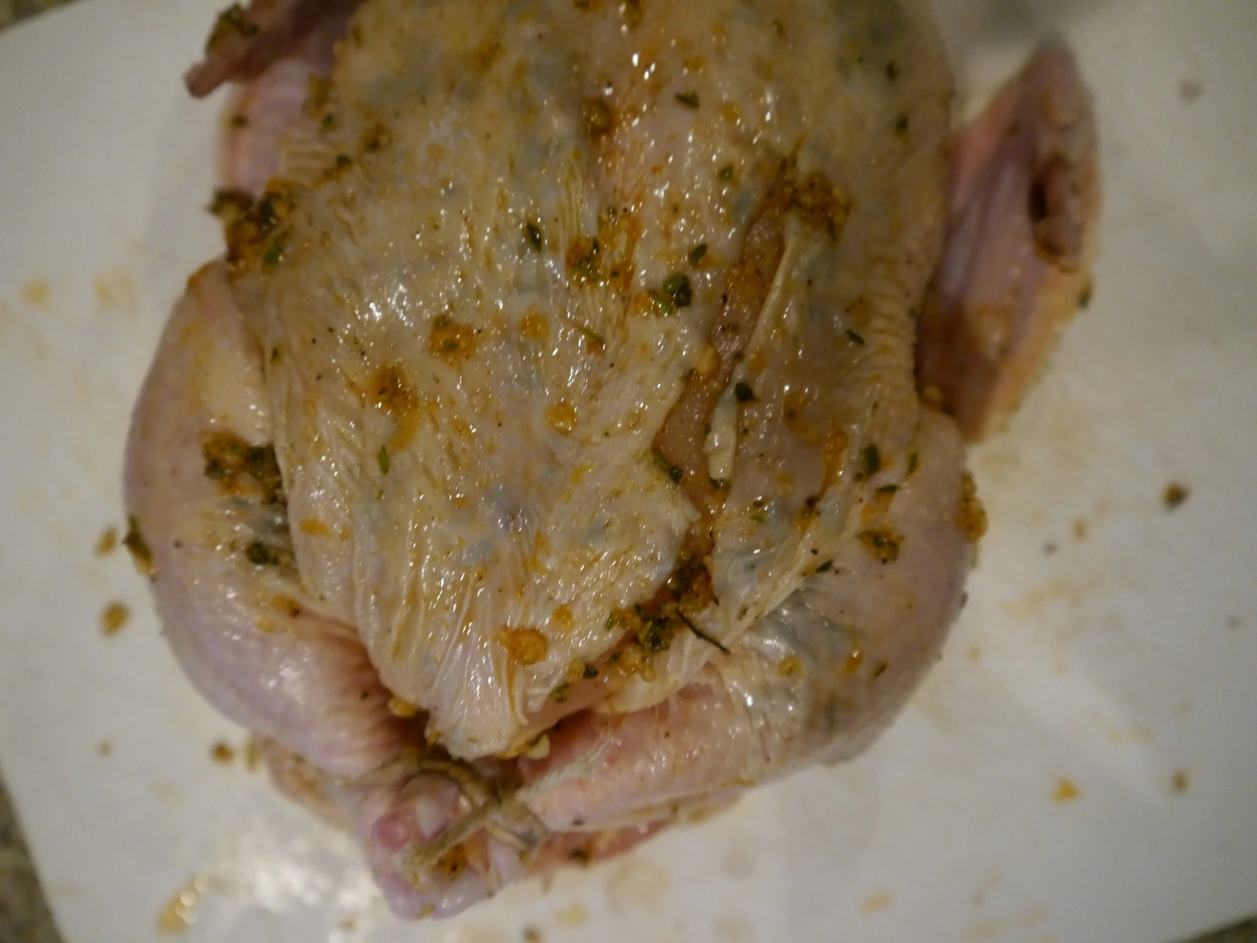 Oh no! I ripped the skin - slathered it too vigorously I guess. I'm a vigorous slatherer. Believe it or not, everything was still ok. Once it was cooked, I carved this baby up and no one even knew about the skin mishap. Until now. 