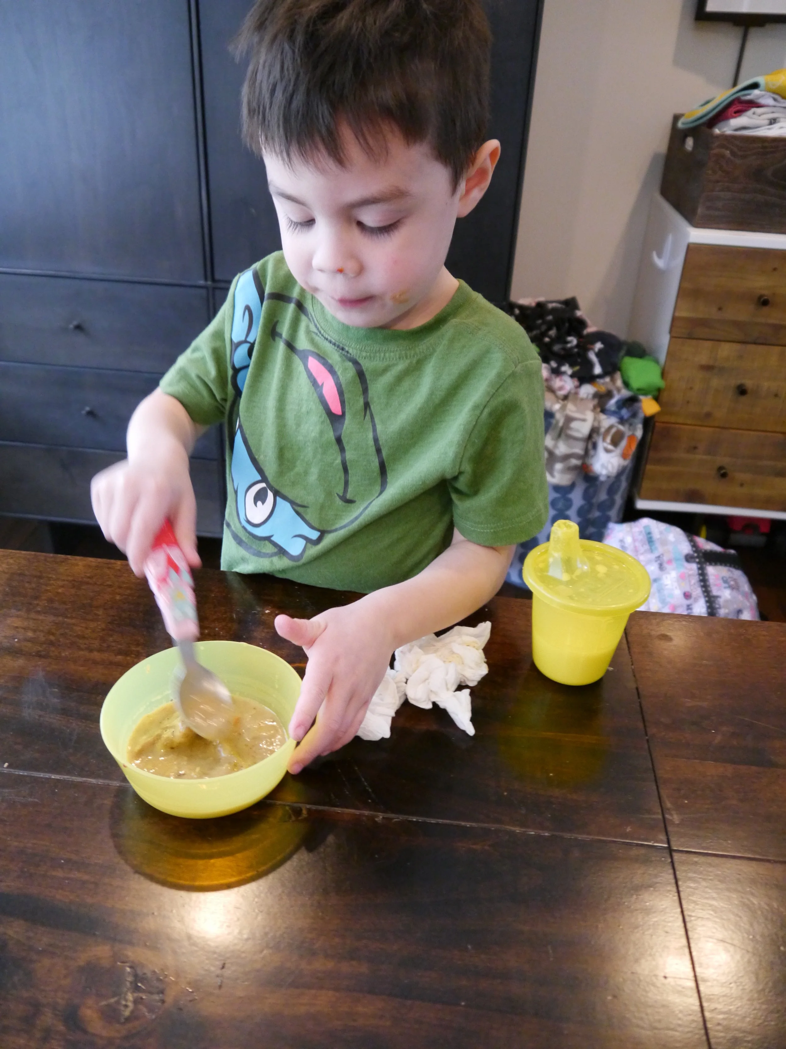 Emmett elected to have his stew as a second course. Goes well with all that peanut butter and jelly still on his face.