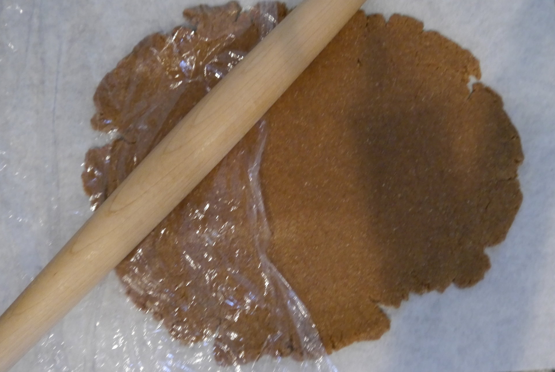 Place a large sheet of plastic wrap over the dough, then roll the dough into a 14-by-12-inch rectangle. 
