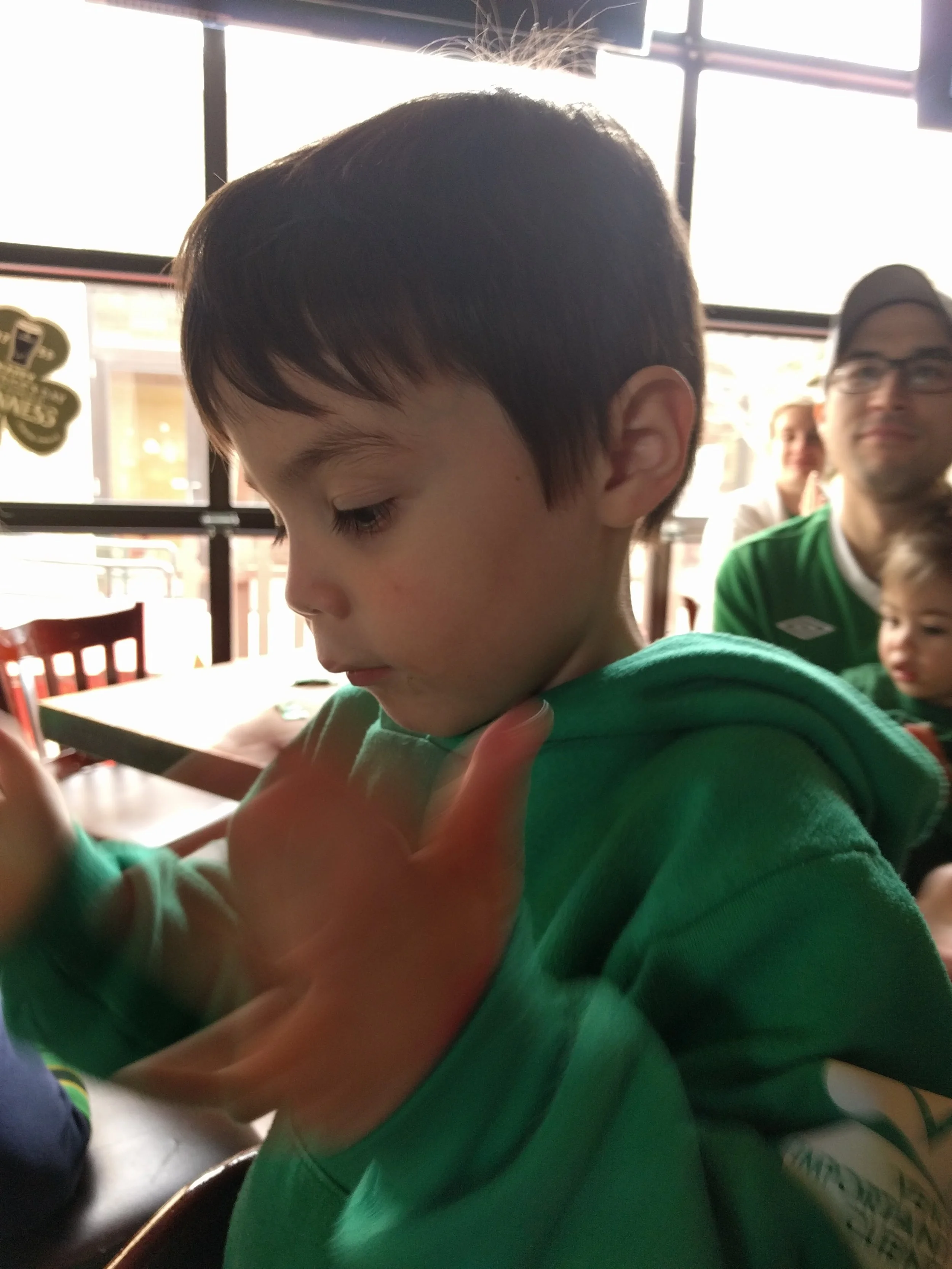 Clapping to the rhythm during an Irish dance performance. 