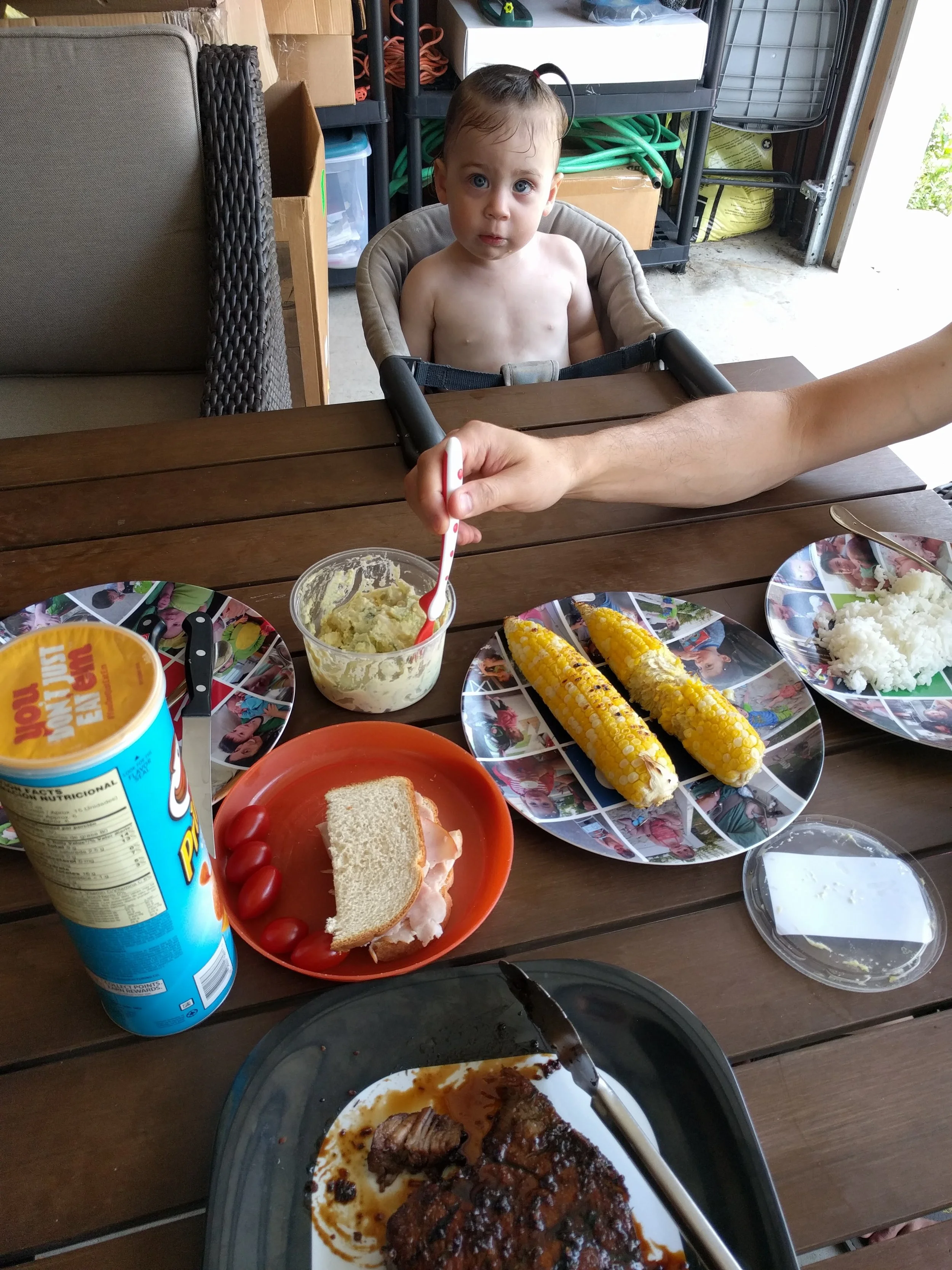 We put our patio umbrella over the kiddie pool so we ate lunch in the shade of the garage. Happy to report that Emmett eschewed his ham sandwich for the jerk pork. Fly the W! Home Cooking 1: Toddler Diet 0. 