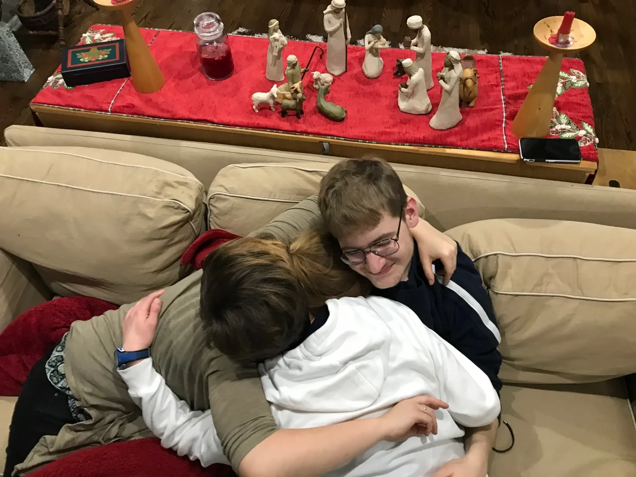 Our kids cuddling before we see each other again in August.