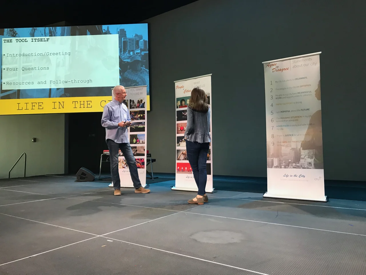 Gabor demonstrating with a volunteer from the crowd how to use the “Life in the City” conversation starter survey and cards. We've used this tool with great success in KC and other places to start spiritual conversations.
