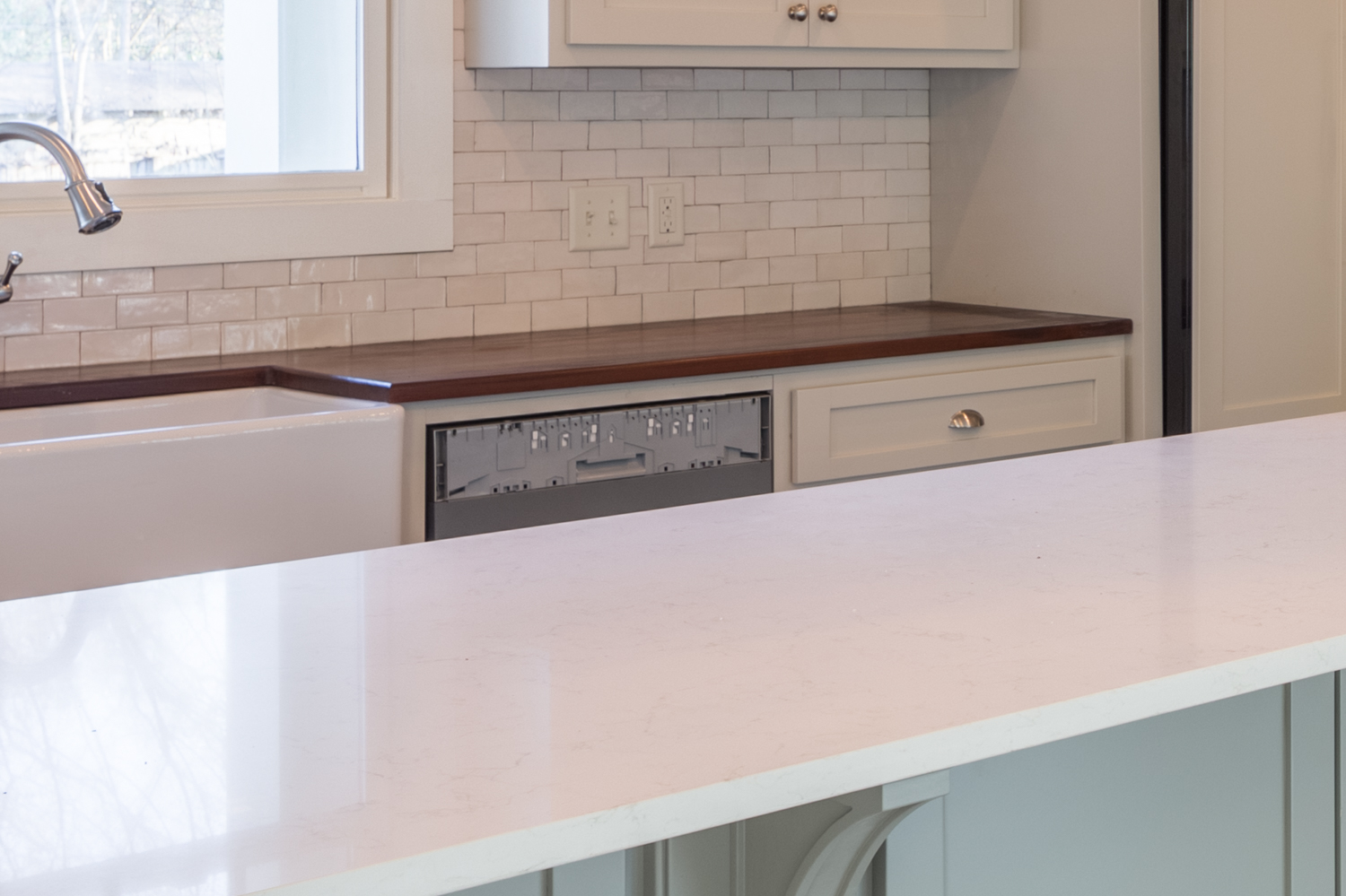 Did you notice the missing panel for the dishwasher? The custom panel wasn't finished at the time of the shoot. Rather than leave it this way I created one in photoshop to match the look.
