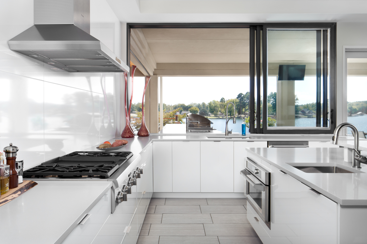 The large windows off the kitchen open to the large rear patio area with grill and pool. So perfect for entertaining!