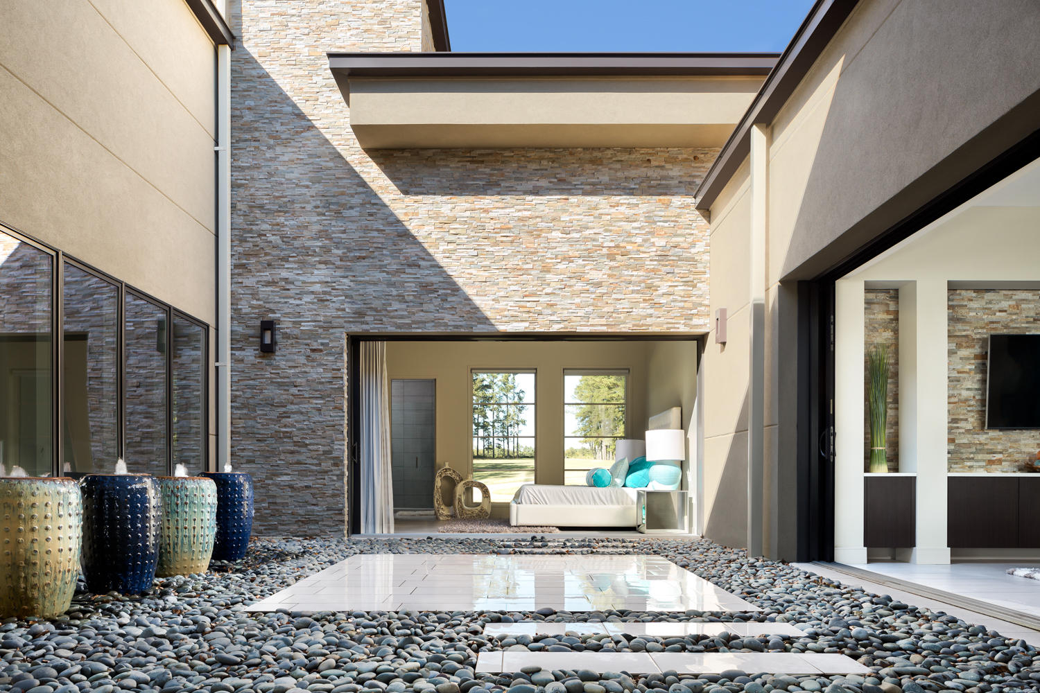 The central courtyard. This angle shows part of the living room (the rest is behind me) and a guest bedroom. This was a very challenging image to create to say the least. There's a huge difference in brightness from the inside and exterior, not to mention all the strong horizontal and vertical lines. It took about 45 minutes to compose the shot, another 45 to shoot it, and about 6 hours in post production putting it all together. I think it was worth it!