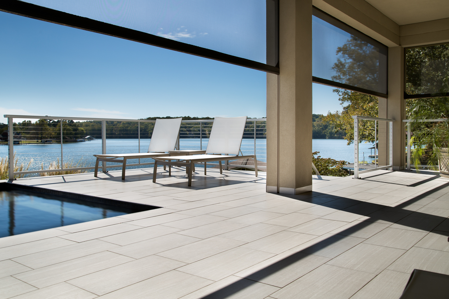 Another key feature for Alexander Modern Homes is the remote controlled, retractable screens. Most of their homes are on a lake and the rear faces west. These screes allow home owners to enjoy their outdoor spaces in all sorts of conditions. We needed a shot that conveyed how they worked within the space. We decided on a shot with them halfway up to better show how they worked.
