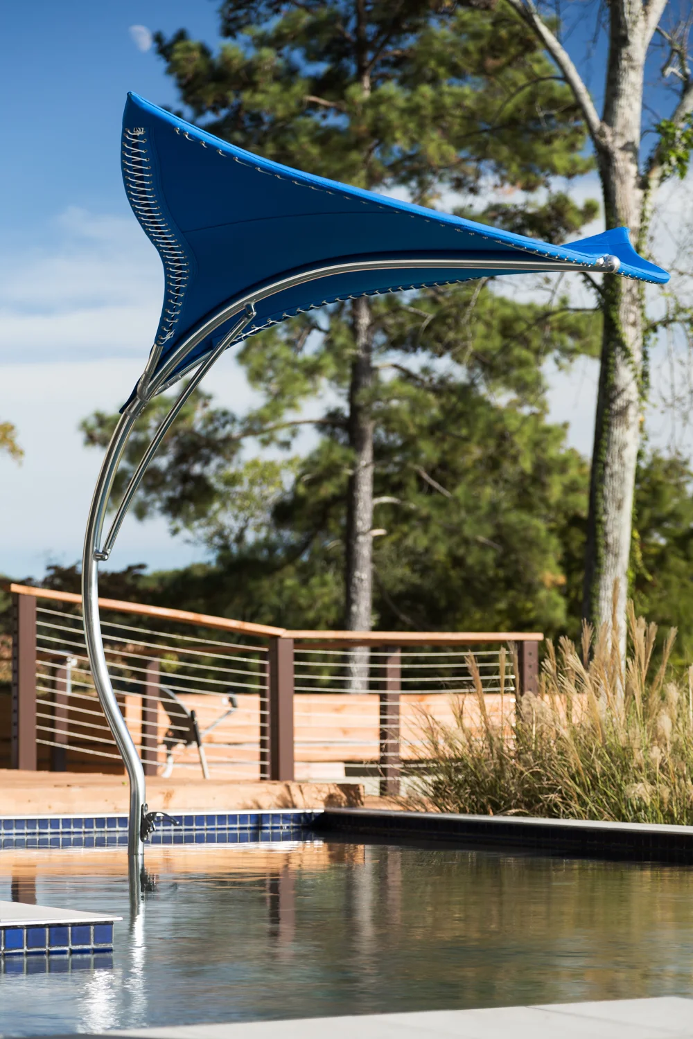 Alexander Modern Homes recently added these Manta outdoor umbrellas by Tuuci as part of their offerings. I've never seen a more impressive, and solidly constructed outdoor umbrella. They are expensive but you can really see a major difference in style and craftsmanship!