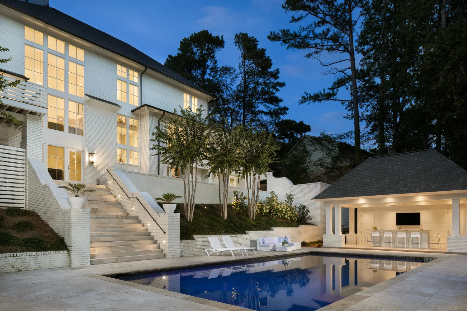 Twilight exterior of the rear and pool. This is one of the most extensive remodel projects I've ever seen. Hard to comprehend the before with the after! 