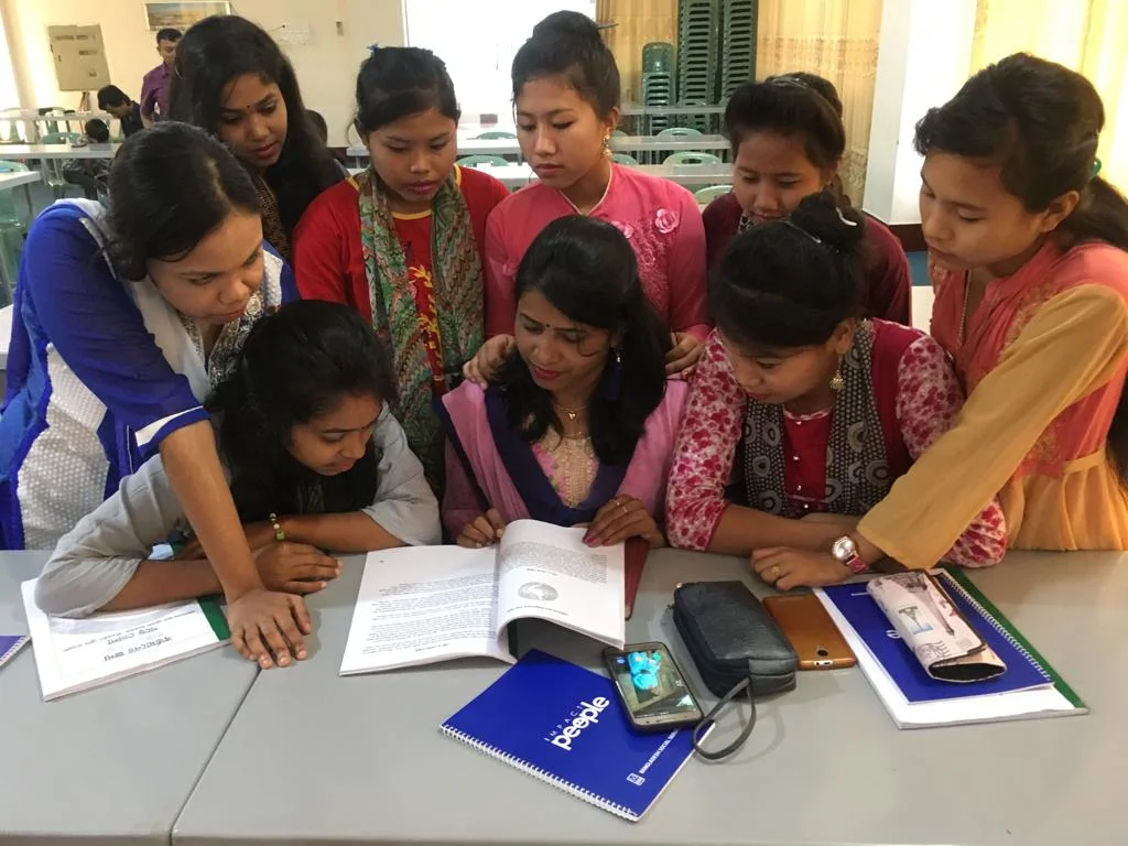 Young women in Bangladesh gather around our “Esther Manual,” as they dig deeper into lessons such as My Identity in Christ, Nurturing My Relationship With God, Servant Leadership, and Leading Where God Has Placed You.