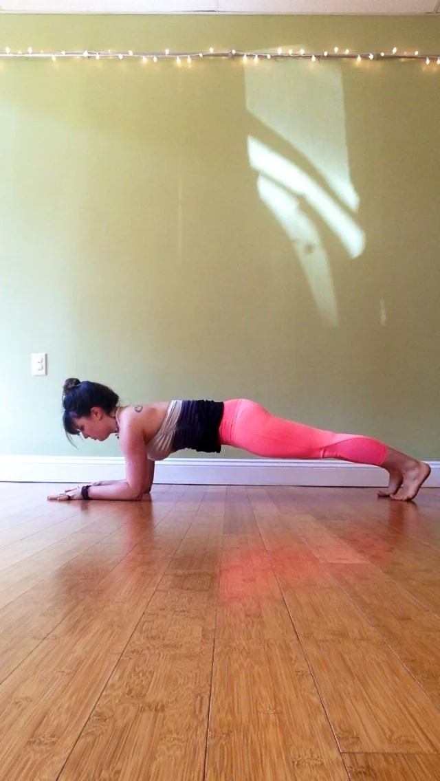 Start in tabletop pose, with your hands and knees on the mat.. Bring your forearms down onto the mat. Make sure your forearms are shoulder distance apart.. Palms should be flat on the mat, fingers spread wide, and shoulders should be aligned over the elbows. Tuck your toes and step one foot back and then the other, coming into your forearm plank. In forearm plank, press through the heels and lift through your inner thighs. Magnetize your belly button and sternum toward one another (when you do this action you should feel a slight tuck of your tailbone toward your heels and an activation in your core). Press down into your forearms to activate/lift the upper back and shoulder muscles. Gaze down between your forearms and continue to breathe, noticing the sensations that show up for you. Stay for at least 5-10 breaths.