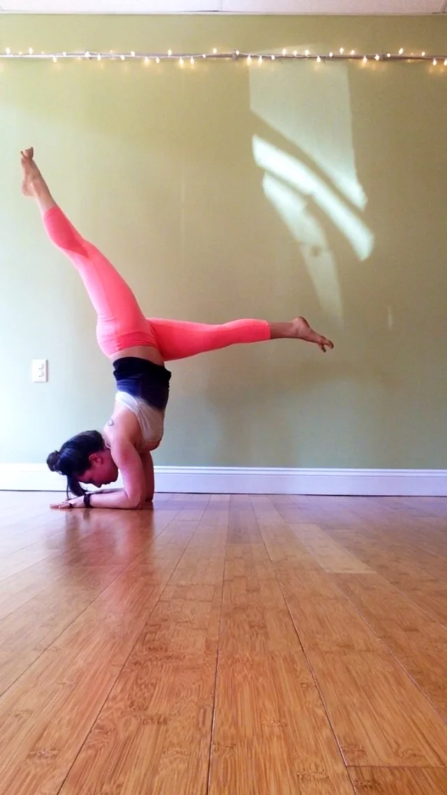 If your arms and core feel strong in the previous variation with the leg lifted (and if your hips and hamstrings feel open) Try moving toward your forearm balance. Walk your feet in closer to your face. Lift one leg,, shifting more weight forward into your forearms and pressing them into the mat. Lift strongly through your extended leg and draw your belly button toward your spine, engaging through the core. Keep your gaze focused on one point, ideally between your hands. Come to the tippy toes of your grounded foot and notice if it feels lighter-- Maybe it even lifts off the mat. To build more control in your inversions, try to lift instead of jump into it. This will create major strength throughout your whole body and make you feel more stable!