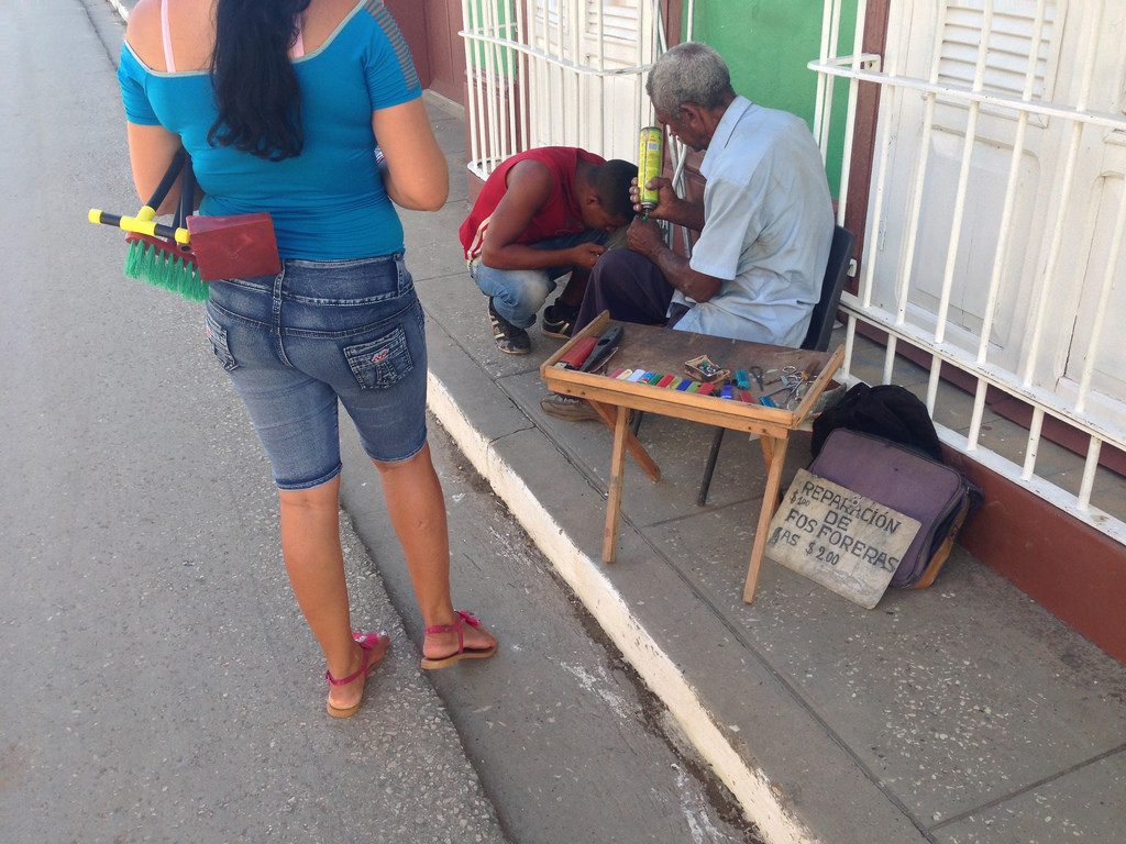 Lighter repair is one of the very narrow trade categories in which Cubans can legally operate independently. (Image: Reuben Strayer )