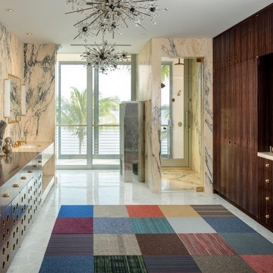 Custom French Polish Macassar Ebony bathroom vanity and closet with custom brass rings designed by @frankdebiasi featured in @dezeen manufactured and installed by #byblosgroup. Article: https://www.dezeen.com/2018/12/21/shulman-associates-lindemann-house-miami-beach/