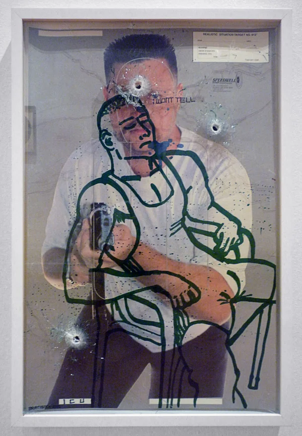I Won't Tell (2010) Ink on vintage American shooting target paper, museum white box frame with laminate glass. Shot three times with a 9mm handgun. 22.5” x 34"
