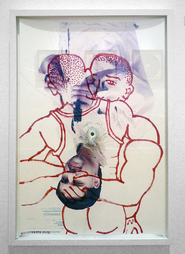 Huggers (2010) Ink on vintage American shooting target paper, museum white box frame with laminate glass. Shot once through with a 9mm handgun 22.5” x 34" ( private collection )