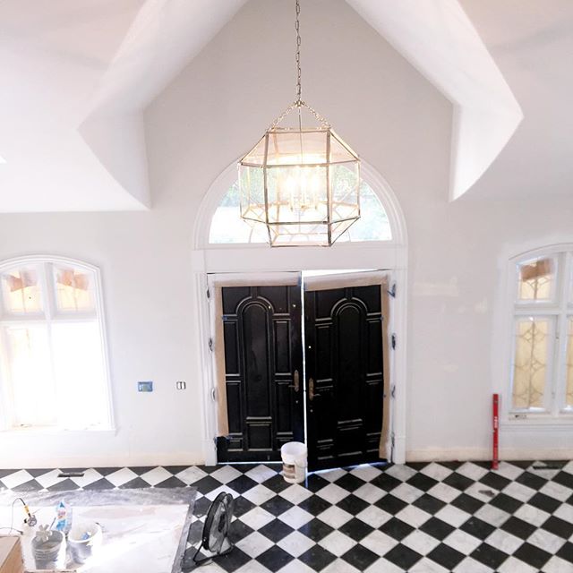 Not sure the tile installer was thrilled about hand-cutting every single piece of marble and bleu chinois French limestone....but it's going to make for one dramatic entry #projectbrittanymeadows #progresspic @exquisitesurfaces