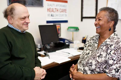 Jon Moscow (left) and Sandra Ford share memories and a laugh in 2008.