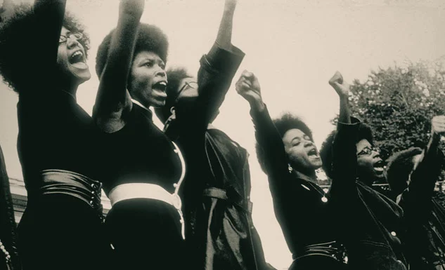 Women saluting, 1968, photo by Ruth Marion Baruch and Pirkle Jones