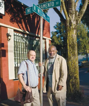 Jon Moscow ’69 (left) and Kent Ford in 2008, on the street corner where the Fred Hampton Memorial People’s Clinic once stood.