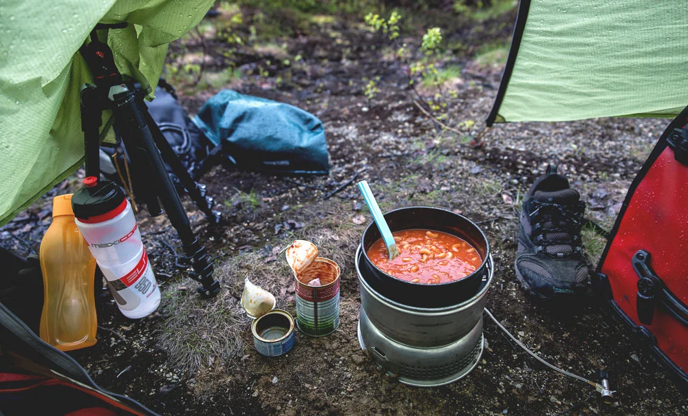 Cooking under the tent door flaps.