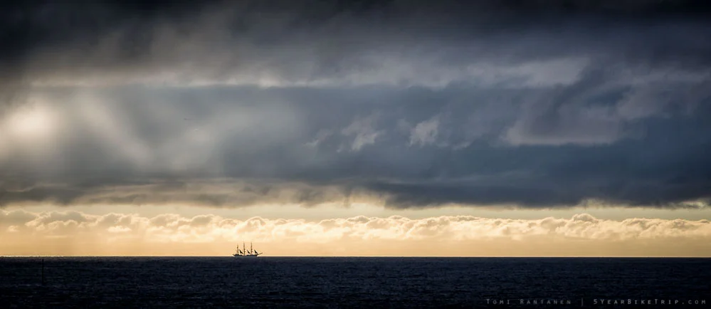 A single sailbot in the horizon.