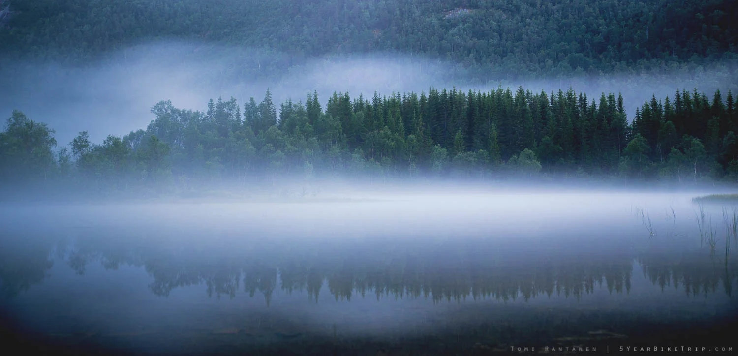 Long exposure shot of a foggy lake.