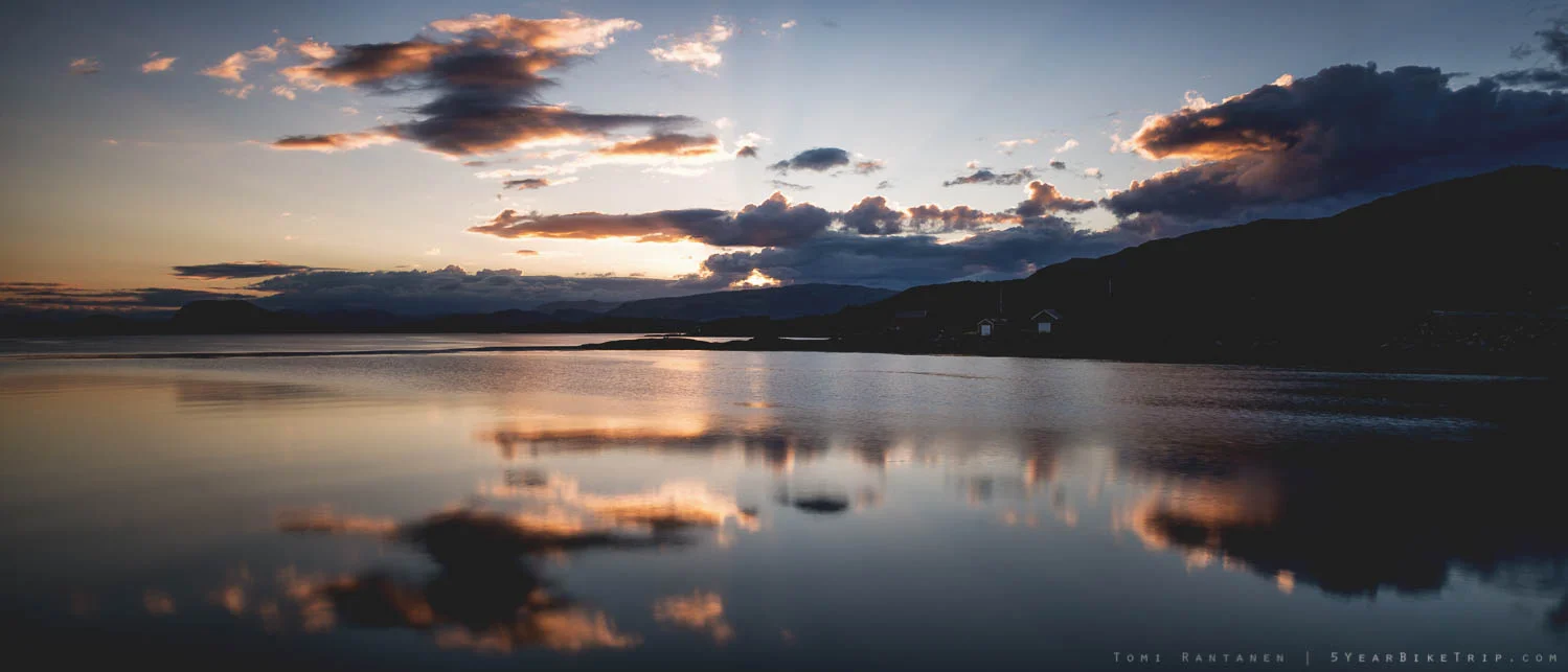Still water reflecting a sunset.